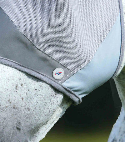 Close-up of a horse wearing a grey fly mask with a visible brand logo.