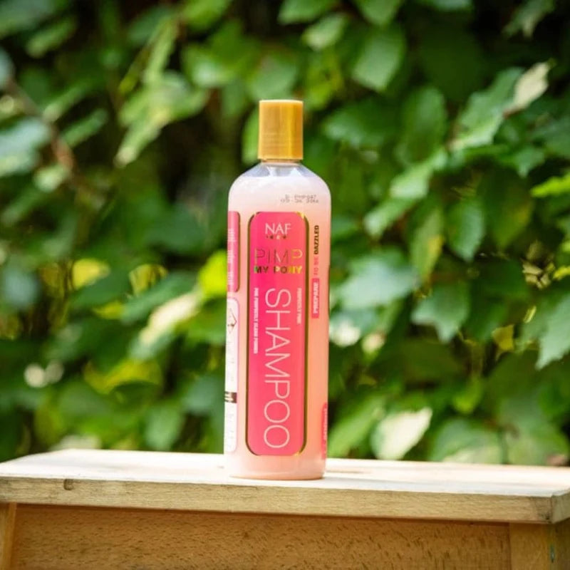NAF Pimp My Pony Pink Shampoo on wooden mounting block