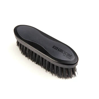 Black grooming brush with 'Ezi-Groom' branding on a white background