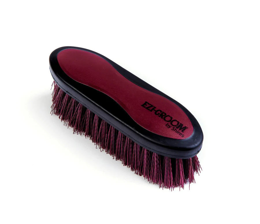 Burgundy grooming brush with 'Ezi-Groom' branding on a white background