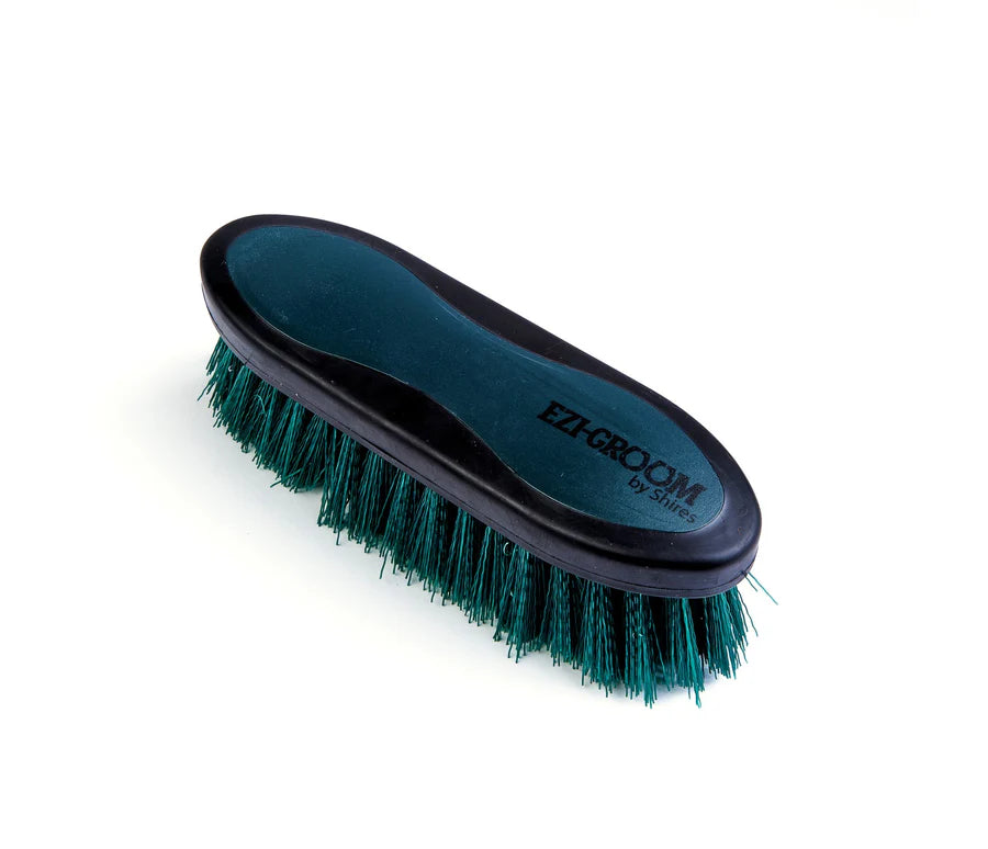 Forest grooming brush with 'Ezi-Groom' branding on a white background