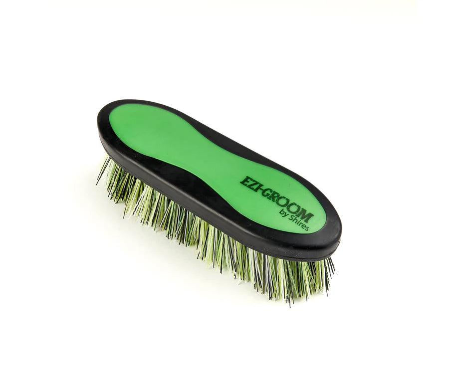 Lime grooming brush with 'Ezi-Groom' branding on a white background