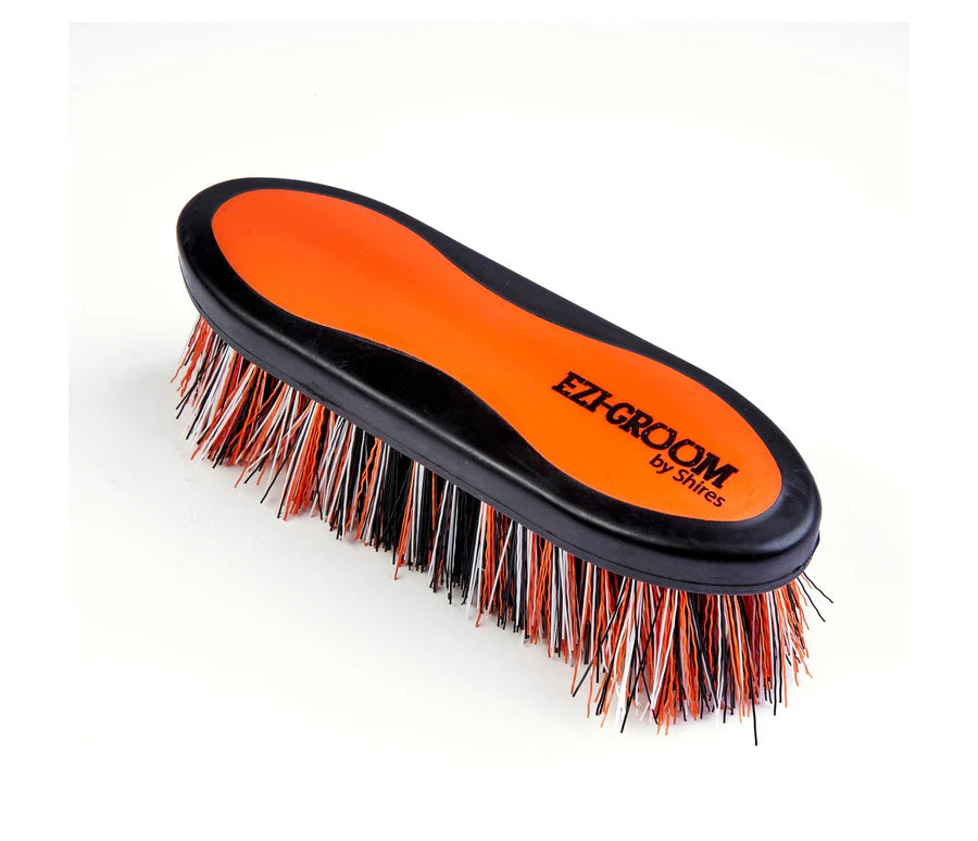 Orange grooming brush with 'Ezi-Groom' branding on a white background