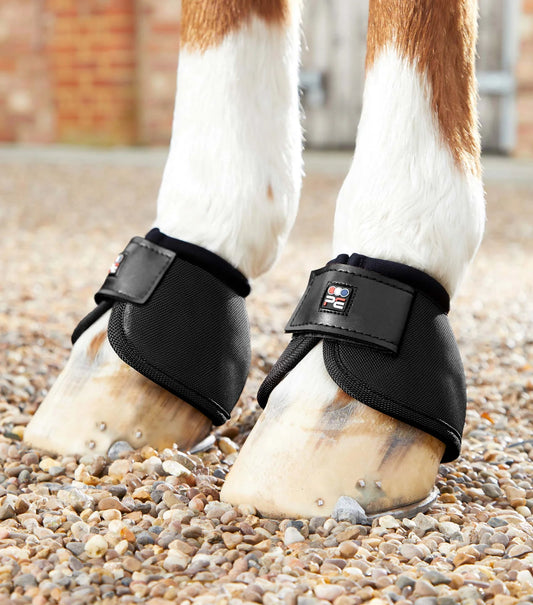 Black Premier Equine Overreach boot on horses hoof