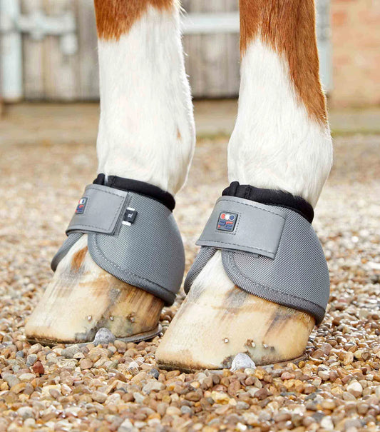 Grey Premier Equine Overreach boots on horses hoof