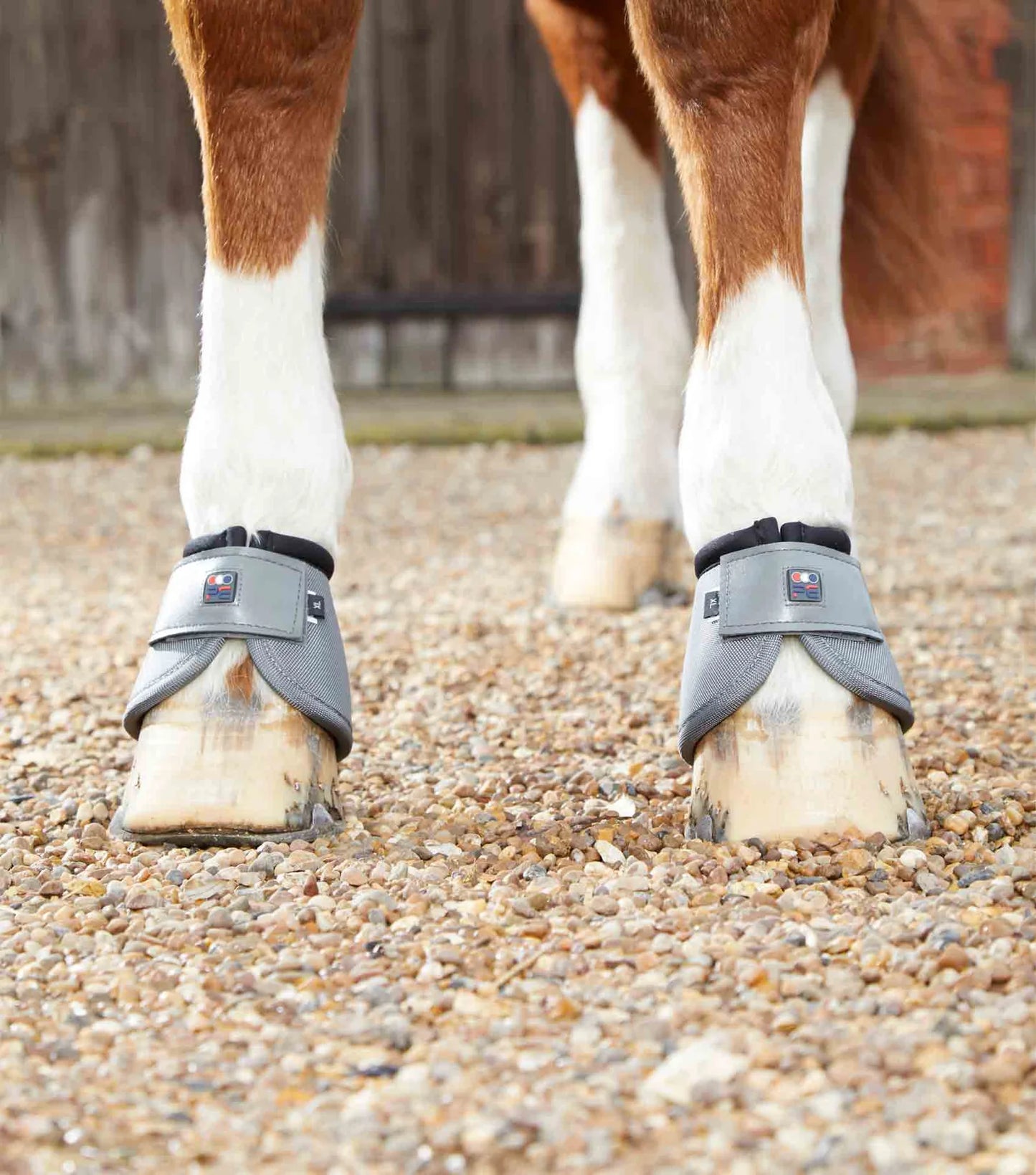 Grey Premier Equine Overreach boots on horses hoof