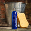 Bottle of Gallop shampoo for greys with a yellow sponge and metal bucket in the background.