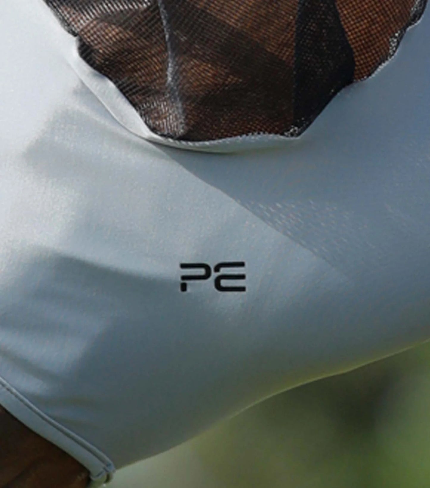 Close up of grey Premier Equine fly mask branding
