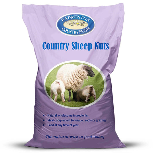 A purple bag of Badminton Country Feels Country Sheep Nuts feed supplement, featuring a circular logo and an image of sheep on a green field.