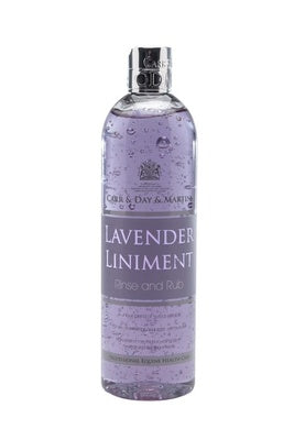 Bottle of lavender liniment with a purple label on a white background