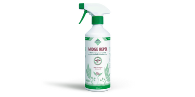 Midge repellent spray bottle on a white background