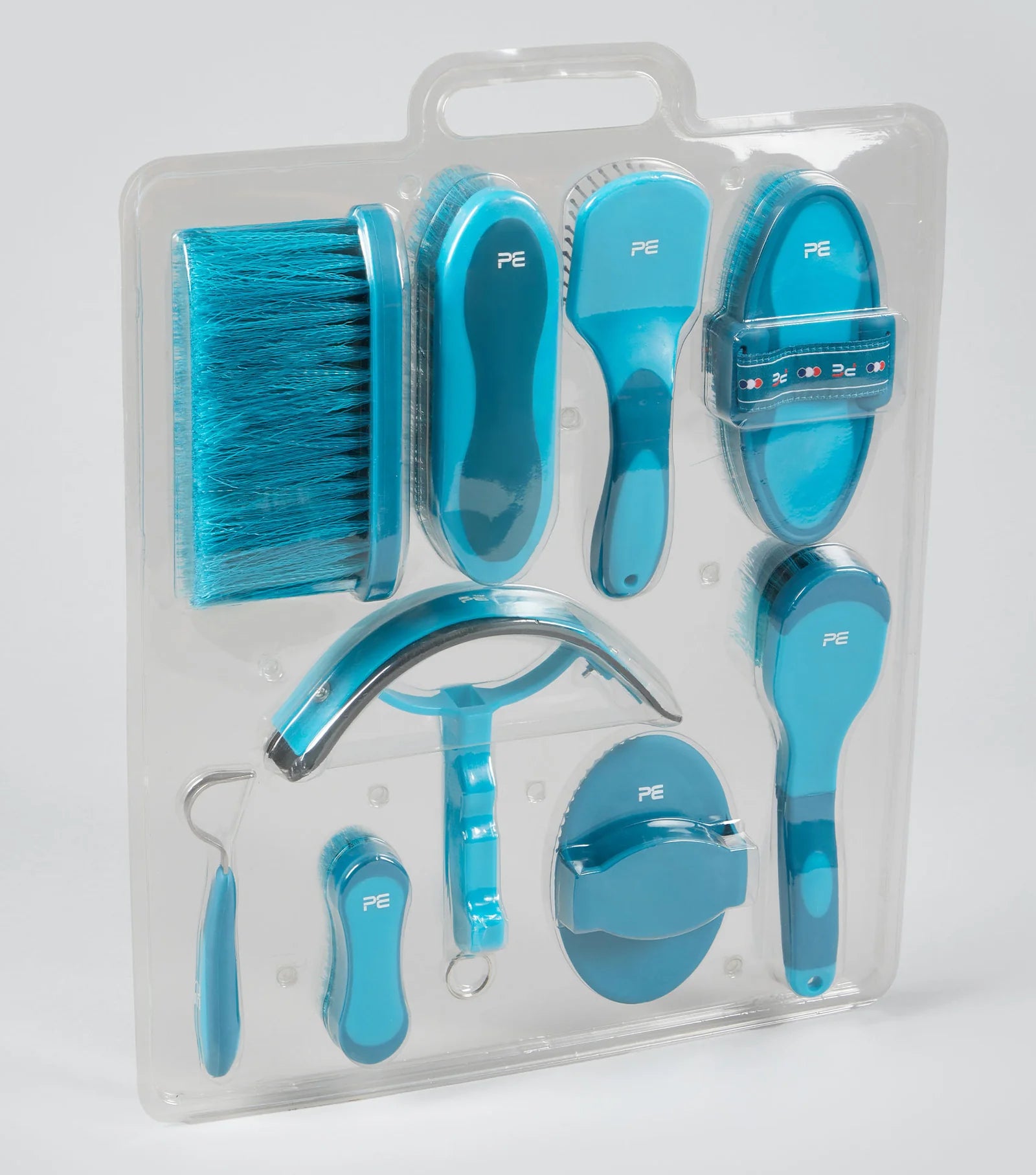Set of blue grooming tools in packaging on a white background