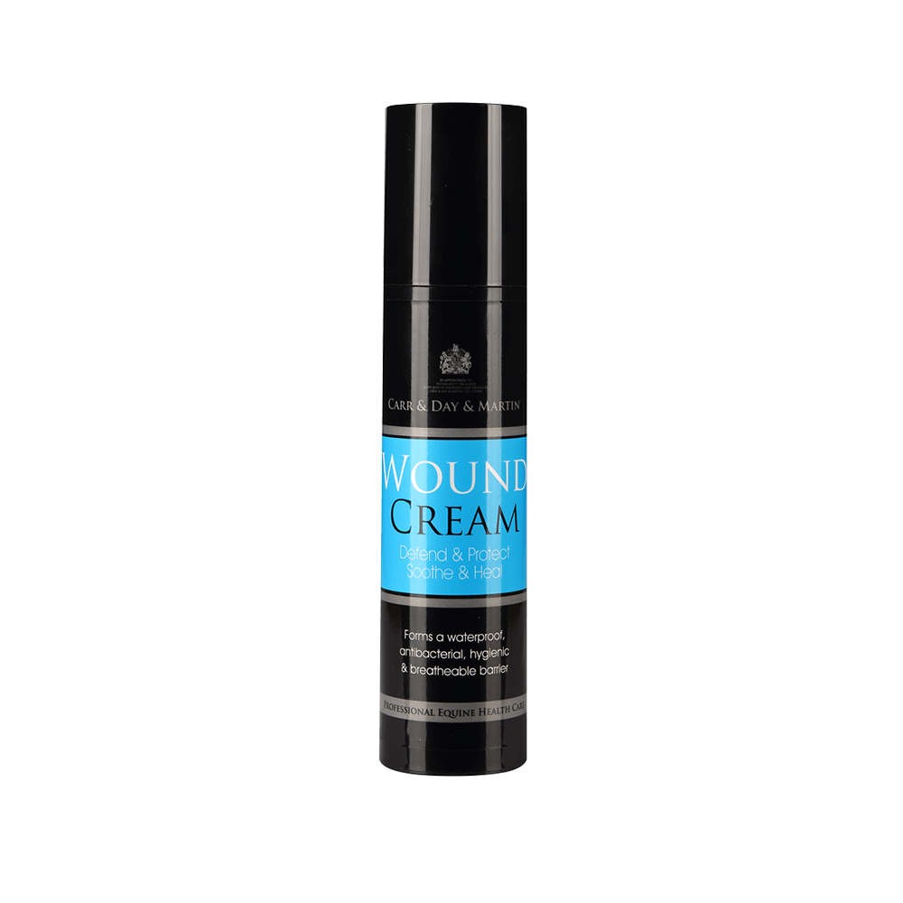 Black  container of wound cream with blue label on a black background