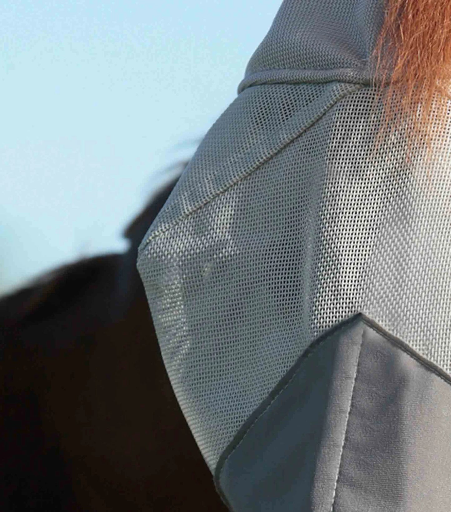 Close-up of a gray mesh fabric with a blurred background