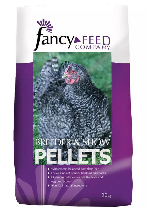 A 20kg bag of Fancy Feed Company Breeder & Show Pellets for chickens, featuring a white and purple bag with a central photo of a black-and-white hen.