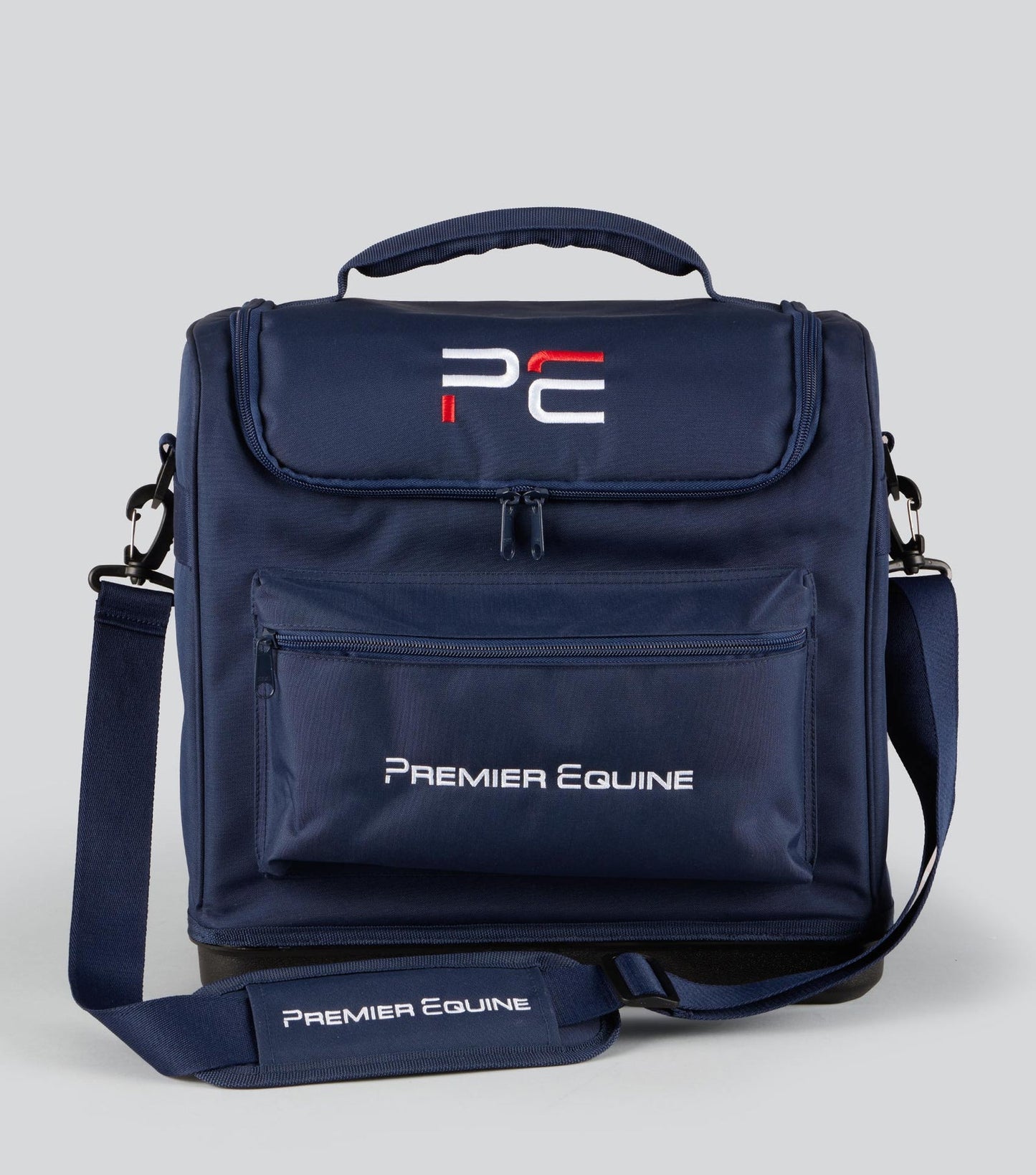 Navy blue grooming bag with Premier Equine logo on a light gray background